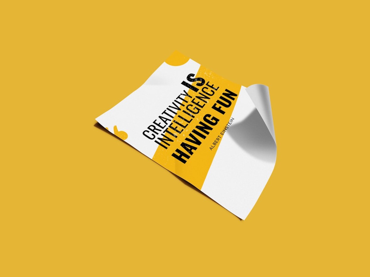 A piece of paper on a yellow background, representing the one-page brand definition every advertiser should write
