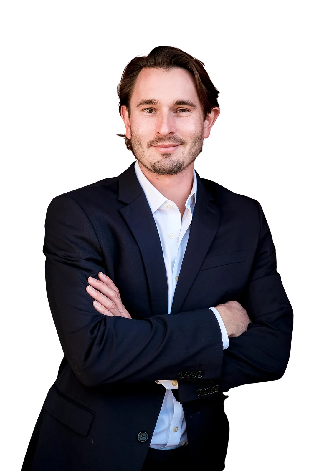 Matt Kundo, smiling, arms crossed, in a navy suit